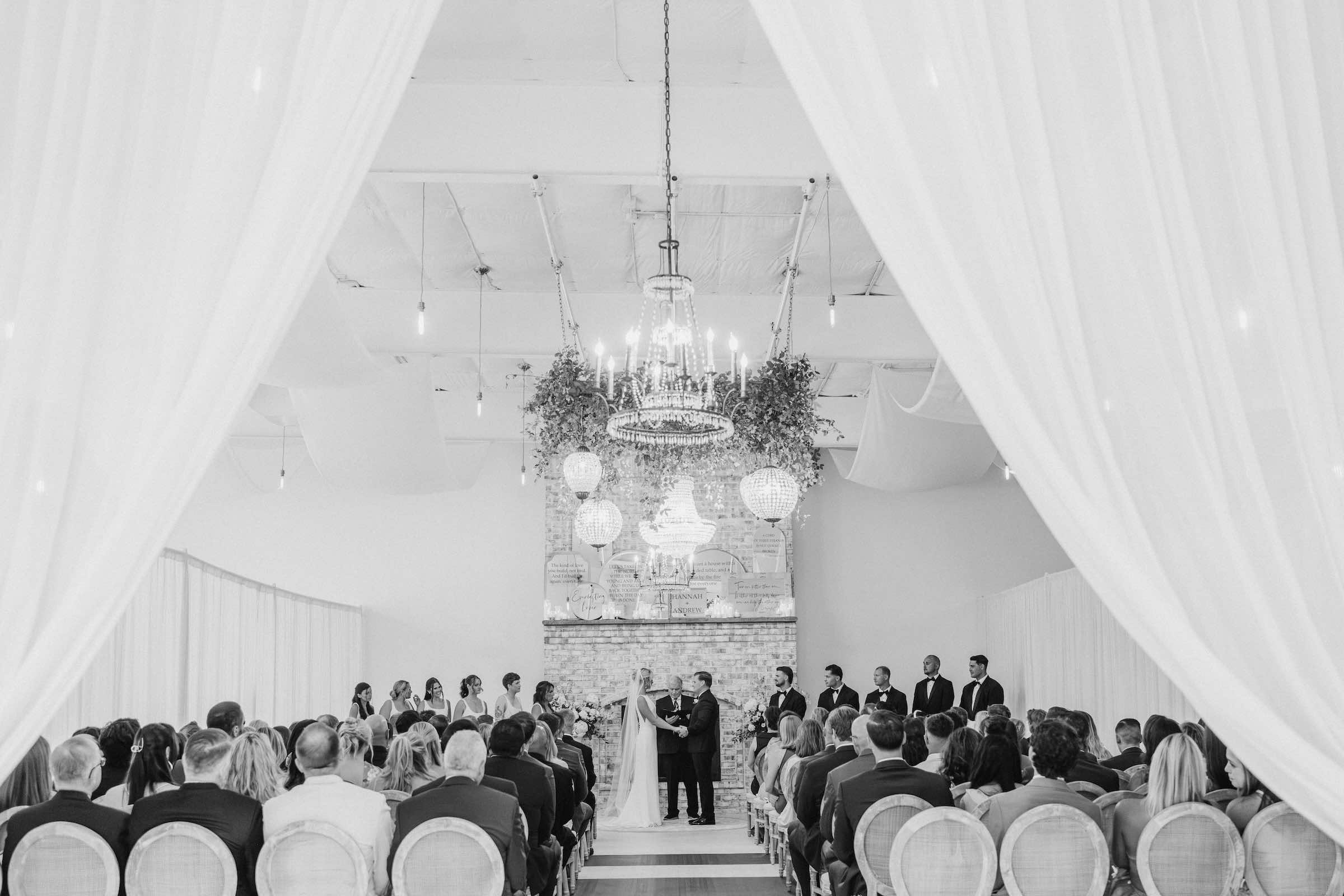 Photo of the full space of the ceremony space of Wrightsville Manor during a couples wedding.