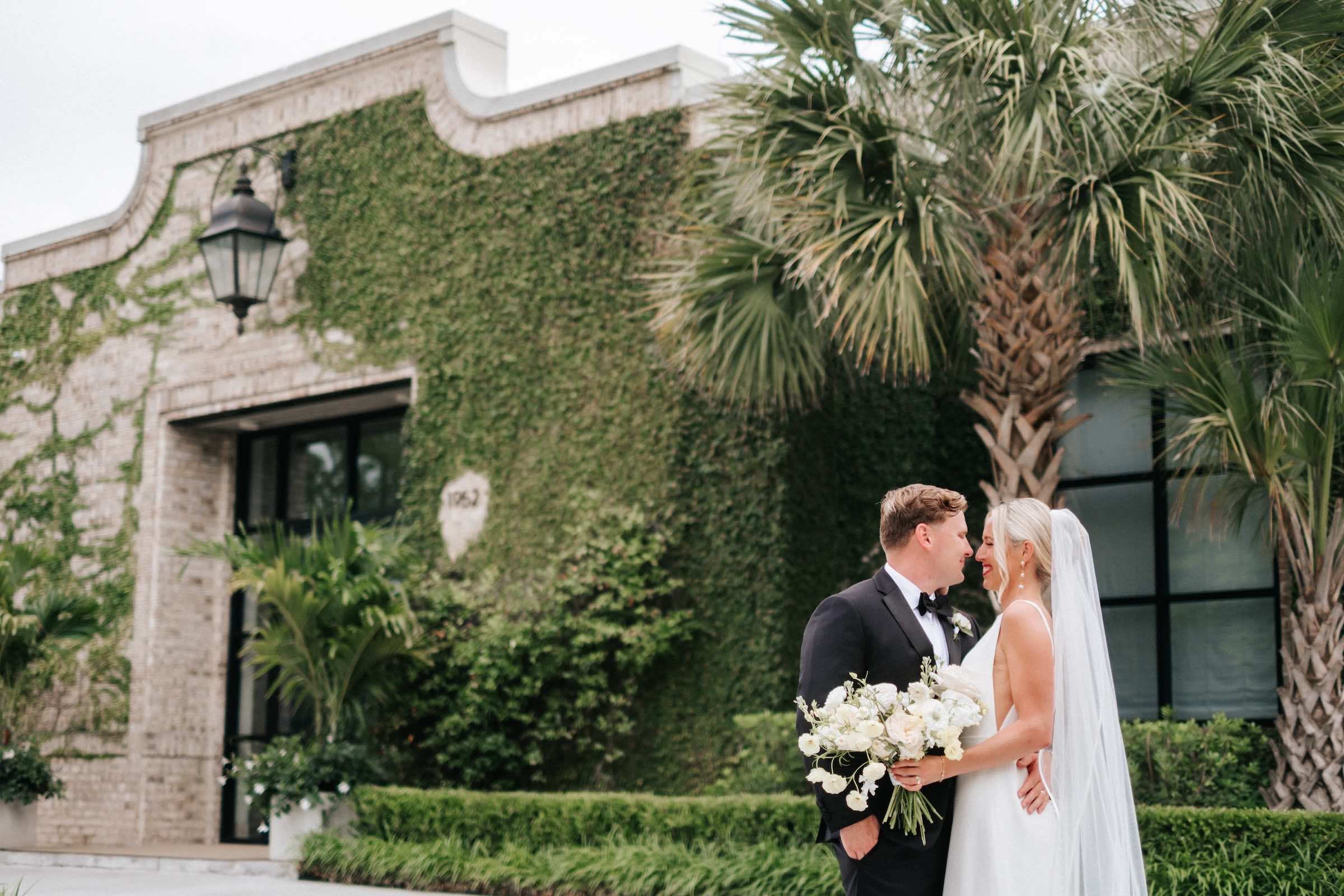 Couple just married in front of Wrightsville Manor in Wilmington.