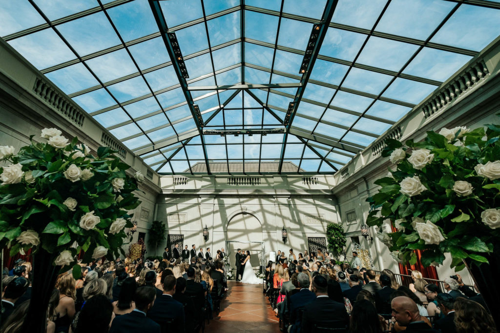 Couple getting married inside of the Derby Court at the Columbus Museum of Art