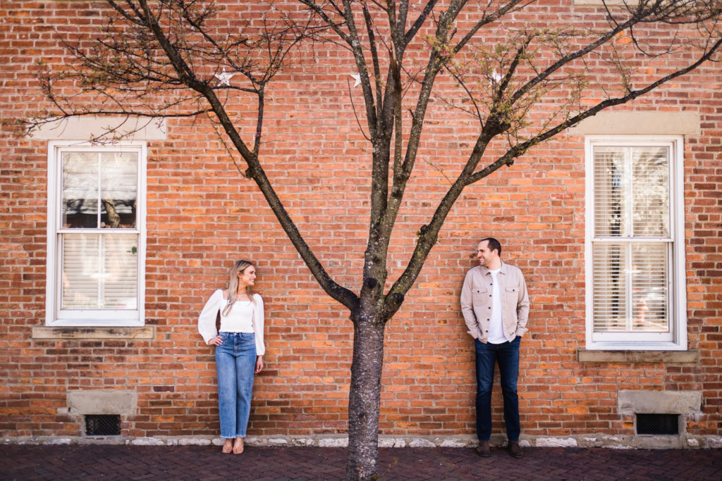 Couple during their German Village engagement session, near Lindey's. Best Places to Propose in Columbus Ohio