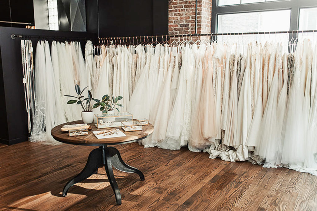 Inside look of B Loved Bridal Boutique showing a wide variety of dresses. 