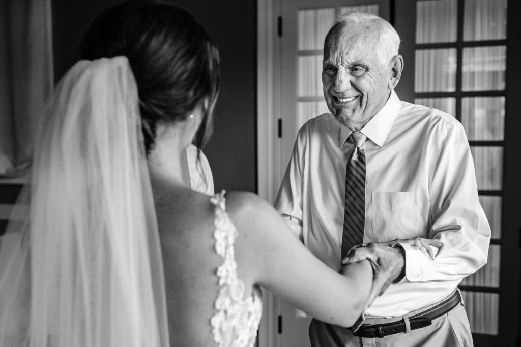 Beautiful first look with bride and grandfather at her wedding at Wedgewood in Columbus. 